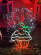 A cupcake light display in a yard.