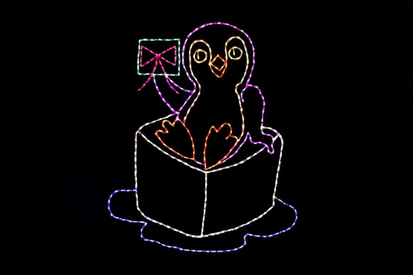 Light display of a penguin holding a letter.