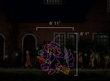 Scaled image of a witch on a broomstick light display.