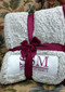 The frosty tipped, high-pile Sherpa material will keep you warm all winter long. The maroon thick color trim and woven patch make for a unique, understated design to show your school affinity. 

Added bonus: Comes packaged folded and tied with a team color ribbon and bow. Makes a great gift!
