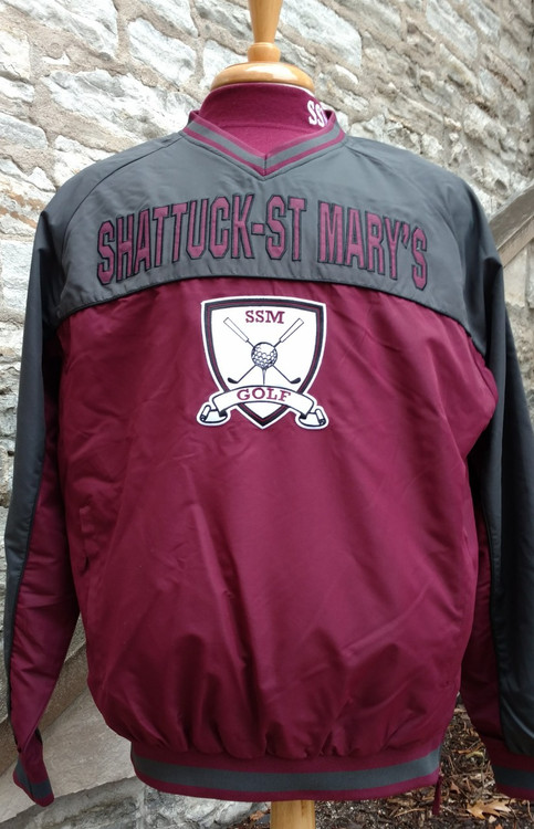 Shattuck - St. Mary's Golf Windbreaker. 100% Polyester, side zipper opening.  Maroon and charcoal, appliqued logos.
