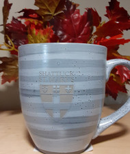 This elegant mug makes use of reactive color clay to create a layering of greys. 16 ounce ceramic mug laser engraved with the SSM logo.