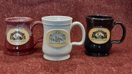 Custom, hand thrown, stoneware mugs produced by second generation Minnesota based Deneen Pottery.

12 ounce mugs  featuring the iconic Arch logo in your choice of Black, Maroon or White. 