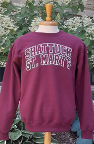 Maroon crewneck sweatshirt with screened Shattuck - St. Mary's logo.  50/50 blend.