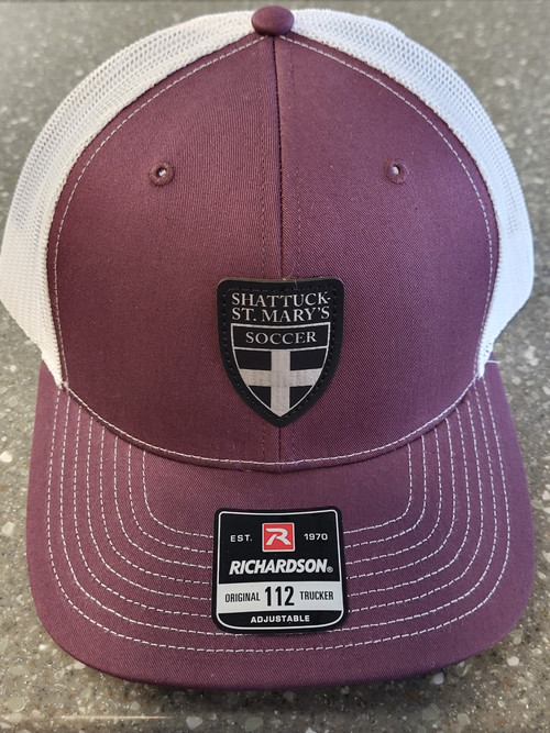 6-Panel structured hat. Cotton twill front, polyester mesh back. Plastic snapback adjustable closure. Mid profile crown.  Leather patch with soccer shield logo.