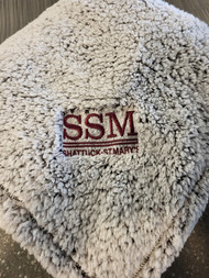 Cozy Fleece, now in a blanket! Ultra-soft meets warmth in this sherpa fleece blanket that is ideal for cooler days when you want to bundle up and get comfy. Embrdoidered with SSM logo.
10.6-ounce linear yard, 100% polyester fleece
Fully hemmed
Dimensions: 50" x 60"