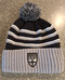 Shattuck-St. Mary's Shield Patch knit Cuffed beanie. Three-stripe design with POM on top.