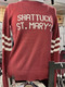 Women's Shattuck-St. Mary's  maroon crewneck sweater with white stripes on sleeves and white lettering on front. Available in women's sizes, small, medium, large, X-Large and XX-Large. 55% Acrylic/45% Cotton.