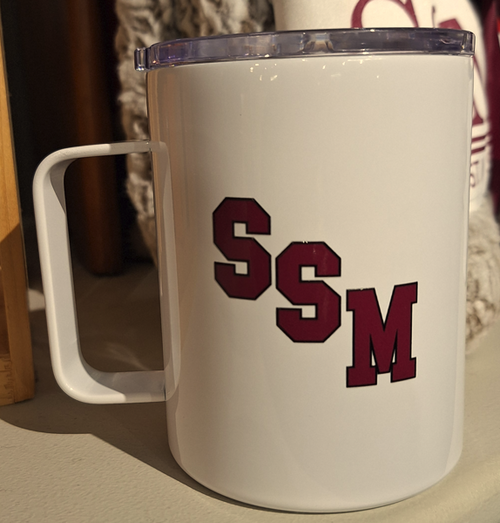 White stainless steel 15oz mug featuring SSM in Maroon lettering. Clear plastic lid included.