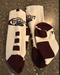 Maroon and white athletic crew socks featuring our very own Shattuck-St. Mary's Hockey Swoosh Logo. Available in Adult size Medium and Large.