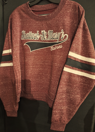 Get ready to show your school spirit with this women's ultra soft loose fit Crewneck cropped sweatshirt. Features Ribbed cuffs and band. Shattuck-St. Mary's Sabres on front with black and white stripes on sleeves. 95% polyester/5% cotton. Available in women's sizes small, medium, large, X-large and XX-Large.