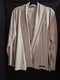 Add an extra layer with style with our Women's Diamonds Knit Cardigan. Ultra soft gray waterfall cardigan featuring SSM in maroon screen print on bottom left side. 88% polyester/12% spandex. Women's sizes small, medium, and large.