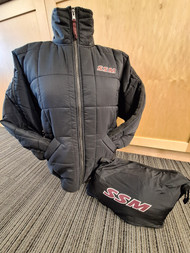 Keep warm on chilly days with the Women's Packable Bonjour Puffer Jacket. This roomy jacket features and an inside zipper pocket that allows you to  easily roll up and pack. Nice for keeping in the car or packing in luggage. Black with maroon embroidered SSM logo on front left chest. Roomy side pockets. 100% polyester.