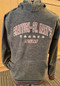 This polar fleece hoodie is perfect for keeping warm and cozy! Gray with maroon and white embroidered Shattuck-St. Mary's Sabres SSM on the front. Features black, maroon and white striped cuffs and waist. 100% polyester