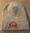 Gray colored knit cuffed beanie featuring maroon embroidered Shattuck-St. Mary's Arch.