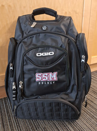 Ogio Metro backpack features back panel side-entry padded laptop pocket, large center storage area. Power cord and mouse storage, internal file sleeve. Weatherproof fleece-lined digital media/audio pockets with headphone exit port,. Adjustable sternum strap, deluxe organization panel. Features new SSM Hockey logo on front.
