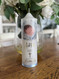 Hand foiled Baptism candle with blue tones and finished with a blue satin ribbon