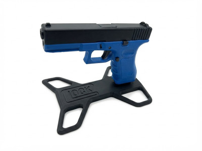 High-angle view of a blue and black pistol mounted on a Black GBB Pistol Display Stand - Glock & Hi-Capa.