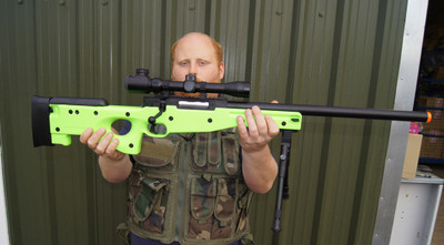 Guy with Zombie Army Sniper rifle in radioactive green inc scope & bipod