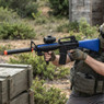 Double Eagle M83 B2 electric Semi Automatic bb gun in Blue shown side-on beside wooden crates outdoors