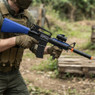 Double Eagle M83 B2 electric Semi Automatic bb gun in Blue held at an angle, showing the blue stock and barrel