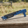 Double Eagle M309 Pump Action Shotgun in Blue, angled side view on a weathered wooden table
