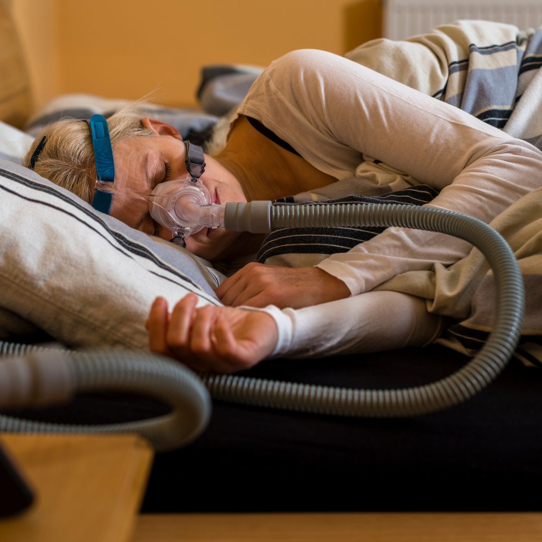 person wearing cpap machine while sleeping