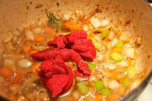 tomato paste added to chopped vegetables in dutch oven
