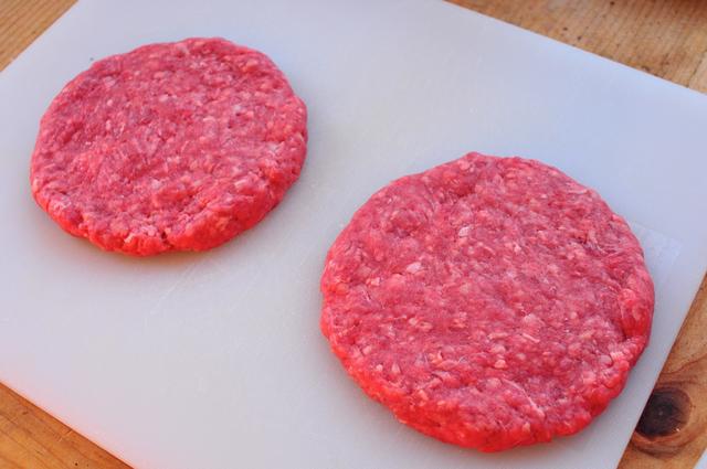 uncooked beef patty in burger form