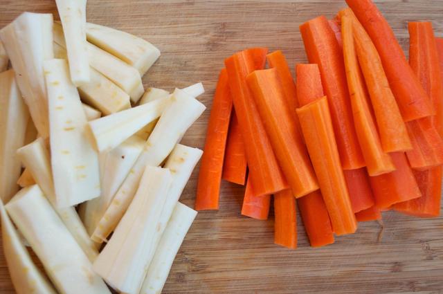 peeled parsnips and carrots cut in half