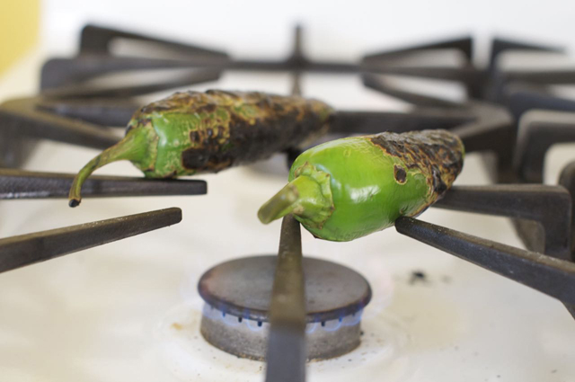 charred jalapenos on gas stove top