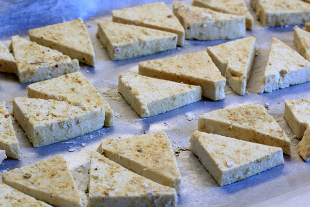 tofu triangles coated in cornstarch and curry seasonings