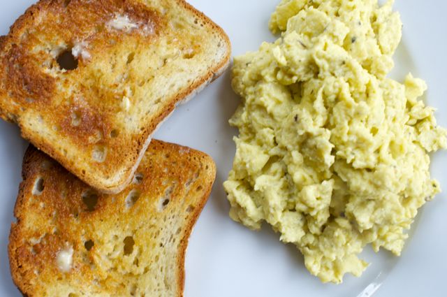 fluffy scrambled eggs with all natural french seasonings and toast bread