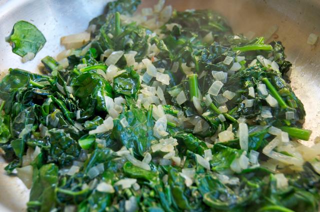 sauteed kale, onion and spinach in pan