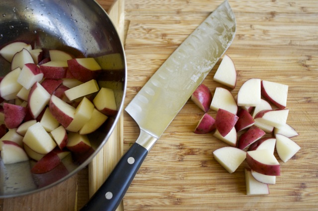 cut red potatoes on cutting board