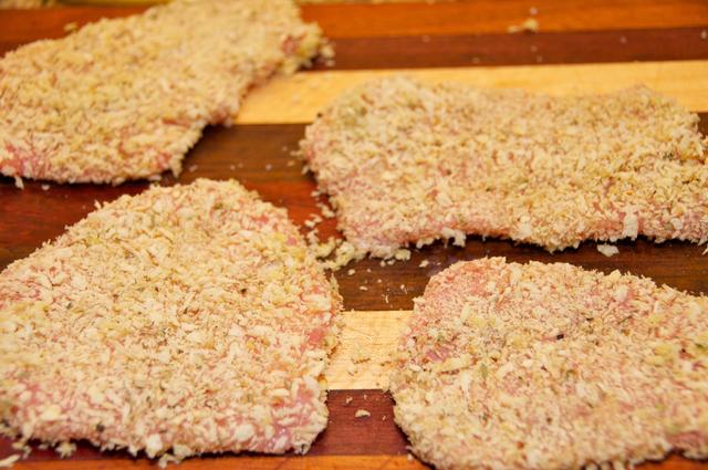 uncooked pounded pork loin crusted with panko breadcrumbs