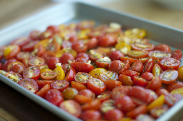 seasoned cherry tomatoes on baking sheet