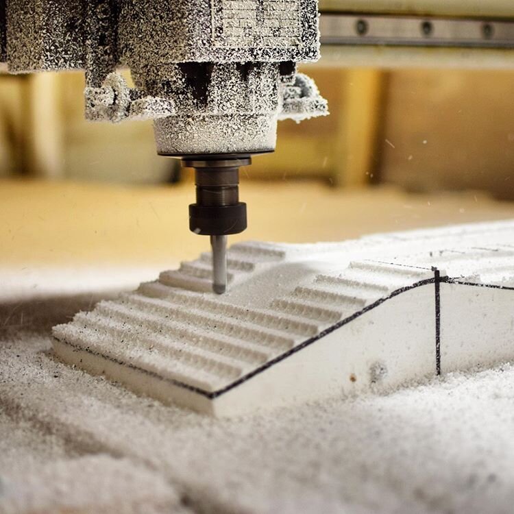 a foam mold being carved out using a CNC