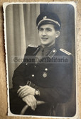 wpc034 - c1952 dated DVP Volkspolizei VP police portrait photo with badge and visor hat
