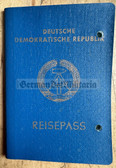 aa125 - c1989 DDR Reisepass Passport for a woman from Berlin - some stamps - hole punched
