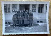 aa525 - NSKK troop in winter uniform outside pub with Schultheiss beer signs