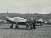 aa556 - multiple Luftwaffe trainers on airfield with pilots