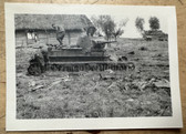 aa575 - Wehrmacht Heer soldiers with destroyed Soviet tank Panzer in battlefield - Russian village