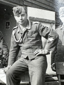 aa672 - Luftwaffe soldiers at barracks hut - Unteroffizier with shooting lanyard and medal ribbons - dated 1940