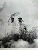 aa697 - Wehrmacht Heer soldiers putting out fire wearing gas masks