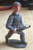 ab125 - DDR toy soldier - NVA with steel helmet and Kalashnikov