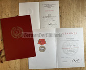 ab564 - NVA Verdienstmedaille in bronze & 40 years NVA anniversary medal award certificates to the same man