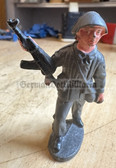 ab476 - DDR toy soldier - NVA with steel helmet and Kalashnikov