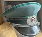 wo619 - original East German Volkspolizei Officer ranks VP VoPo BePo police visor hat - size 57