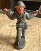 oo024 - 3 - DDR toy soldier - NVA with steel helmet and AK on his shoulders